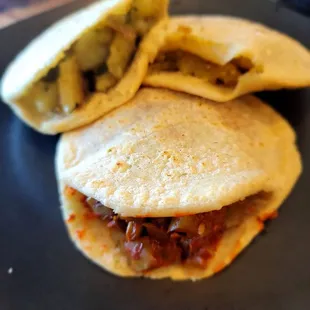 Gorditas de chicharon, papa's y rajas, nopales y carne, tinga and cochineta pibil.