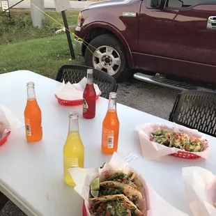 a table full of food and drinks