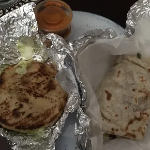Gordita on the left with the red sauce. Green sauce was also an option. Guessing it might be more mild.