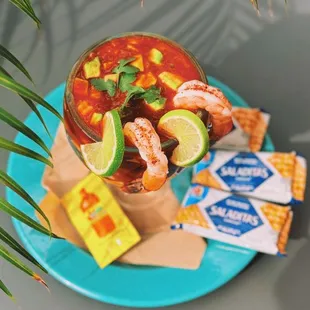 Coctel de Camarón, Ceviche
(Poached and chilled shrimp in  house cocktail sauce with fresh avocado and lime, served with saltine crackers).
