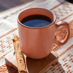 Café de Olla, traditional brew made with piloncillo, cinnamon, and citrus for a bold, flavorful taste.