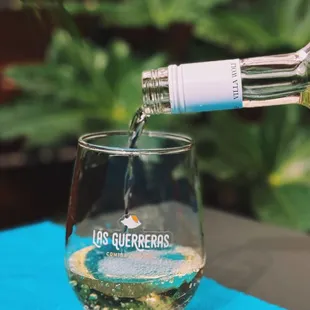 A crisp and refreshing pour of white wine, perfect for pairing with our coastal-inspired dishes.