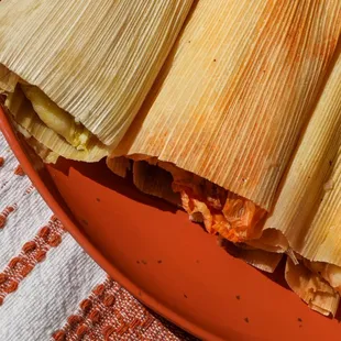 Variety of corn husk tamales, made with gluten &amp; GMO-free masa. Meat &amp; vegan options. Order in person or for catering. They sell out fast!