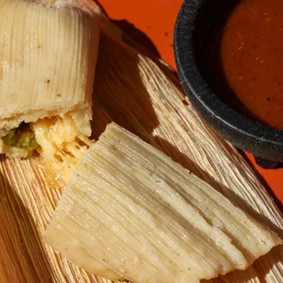 Cheese &amp; rajas corn husk tamal, made with gluten &amp; GMO-free masa. Order in person or for catering. They sell out fast!