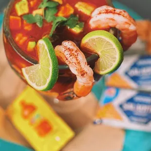 Campechana Ceviche (Poached shrimp, octopus and fresh oysters, in house cocktail sauce with fresh avocado and lime with saltine crackers)