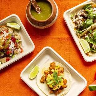 Tacos, each one served with different toppings and salsas.