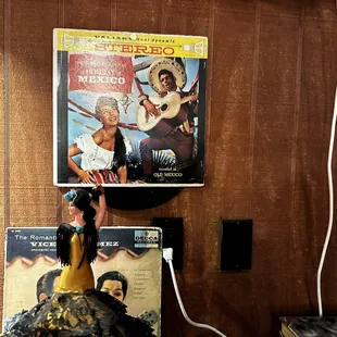 Old Mexican LP covers on the wall.