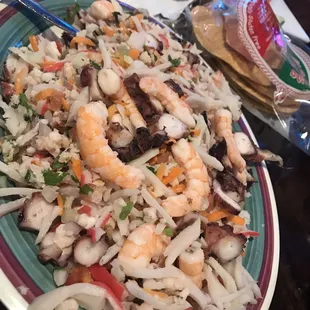 a plate of shrimp and rice salad