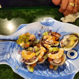 a plate of shrimp and clamsel