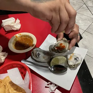 a person grabbing a plate of food