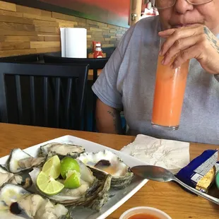 Oysters and a delicious tequila sunrise