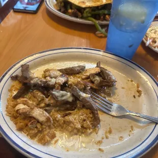 a plate of food and a glass of water