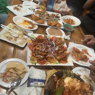 Our feast: Molcajete Azteca, Langostinos, camarones veneno, empanadas, ceviche.