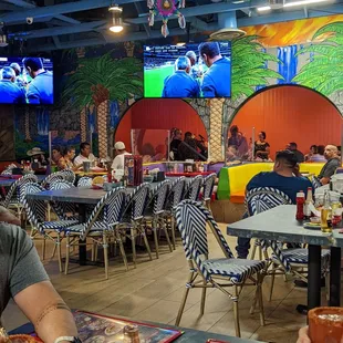 a man sitting at a table in a restaurant
