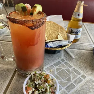 Micheladas. Fish ceviche and a basket of tostadas and saltine crackers which are free
