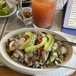 Marinated raw shrimp with octopus and raw oysters. And tomato onions and avocado.