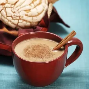 a cup of coffee with cinnamon