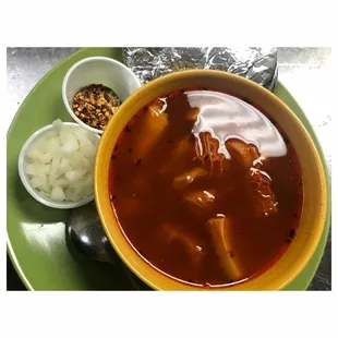 a bowl of soup and a bowl of onions