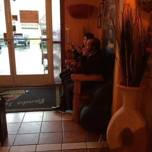 two people sitting in a restaurant