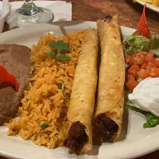 Chicken Flautas with rice, refried beans and more