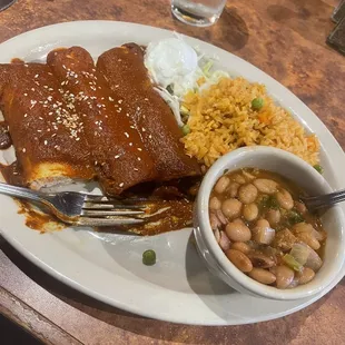 Mole enchiladas with charro beans and rice