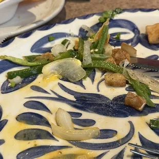 Piles of sliced jalepenos in egg dish. None were chopped or in small enough pieces to eat.