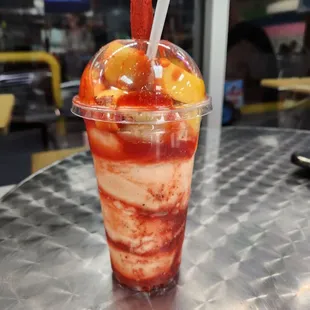 Large Mangonada. (Mexican vanilla ice cream with chamoy syrup topped with sliced mangos)