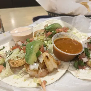 Shrimp tacos. That red sauce was hot and also slightly bitter. If that&apos;s not your thing, stick to the white sauce.