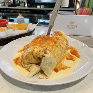 12.50$ excellent wet burrito, chicken. Muy Bueno!  Lots of to go business.