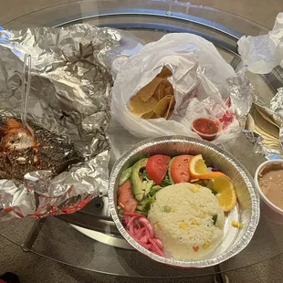 Fish with rice, salad, beans, chips and tortillas