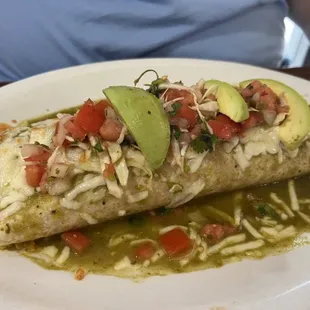 Burrito Caifornia:
 Grilled Chicken, rice and beans rolled in a large flour tortilla topped with Monterrey Jack cheese green tomatillo salsa