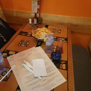 a woman sitting at a restaurant table