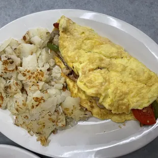 Chicken fajita omelette with hash browns. If you&apos;re having trouble choosing I recommend them!