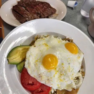 Chilaquiles Verdes with skirt steak on the side.