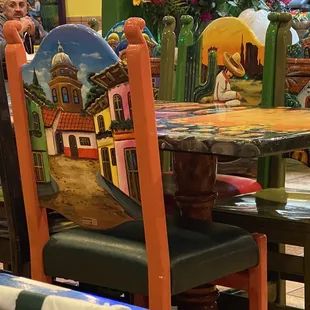 a colorful table and chairs