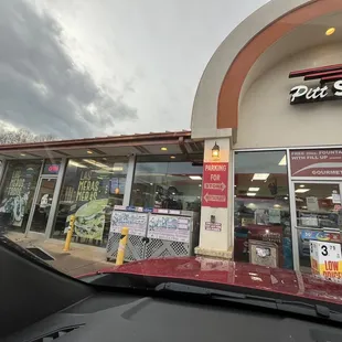 Outside. Attached to a gas station, had a connection door inside.