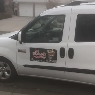 a white van parked on the side of the road