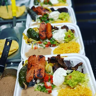 a long line of trays of food