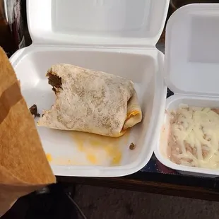 Flour chips, a burrito with only meat, and beans with cheese on top. $21