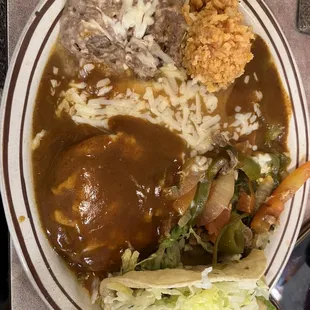 Combo plate. Beef taco. Cheese enchilada, chili rellano and steak ranchero. With beans and rice. Refried beans taste like the real deal!!