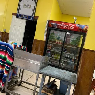 a kitchen with a table and chairs