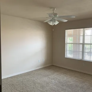 Large and spacious bedroom with ceiling fan light