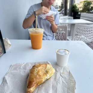 Guava and cheese Pastry, orange juice (fresh squeezed), and a Cortadito