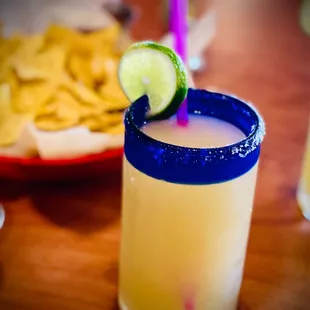 a margarita with a lime garnish