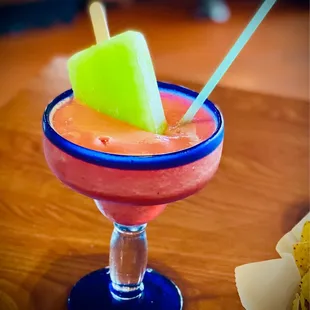 a drink with a popsicle sticking out of it