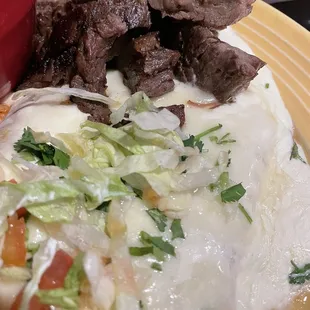 Shrimp Enchiladas with Beef Fajita on top