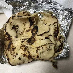 Come on guys why would you guys serve a burnt and broken corn tortilla?
