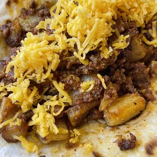 Potato &amp; chorizo Tacos ( added Shredded Cheese )