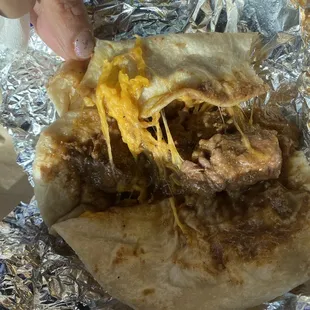 So &quot;we&quot; have eaten one large piece of fat. Open taco to see this left.  Two pieces of carne guisada.  #WheresTheBeef?