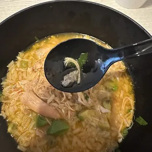 a bowl of soup with a spoon in it
